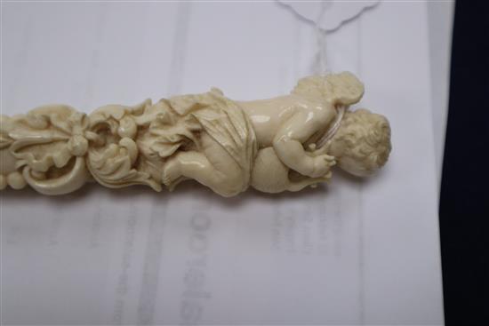 A 19th century Dieppe carved ivory parasol handle length 27.5cm